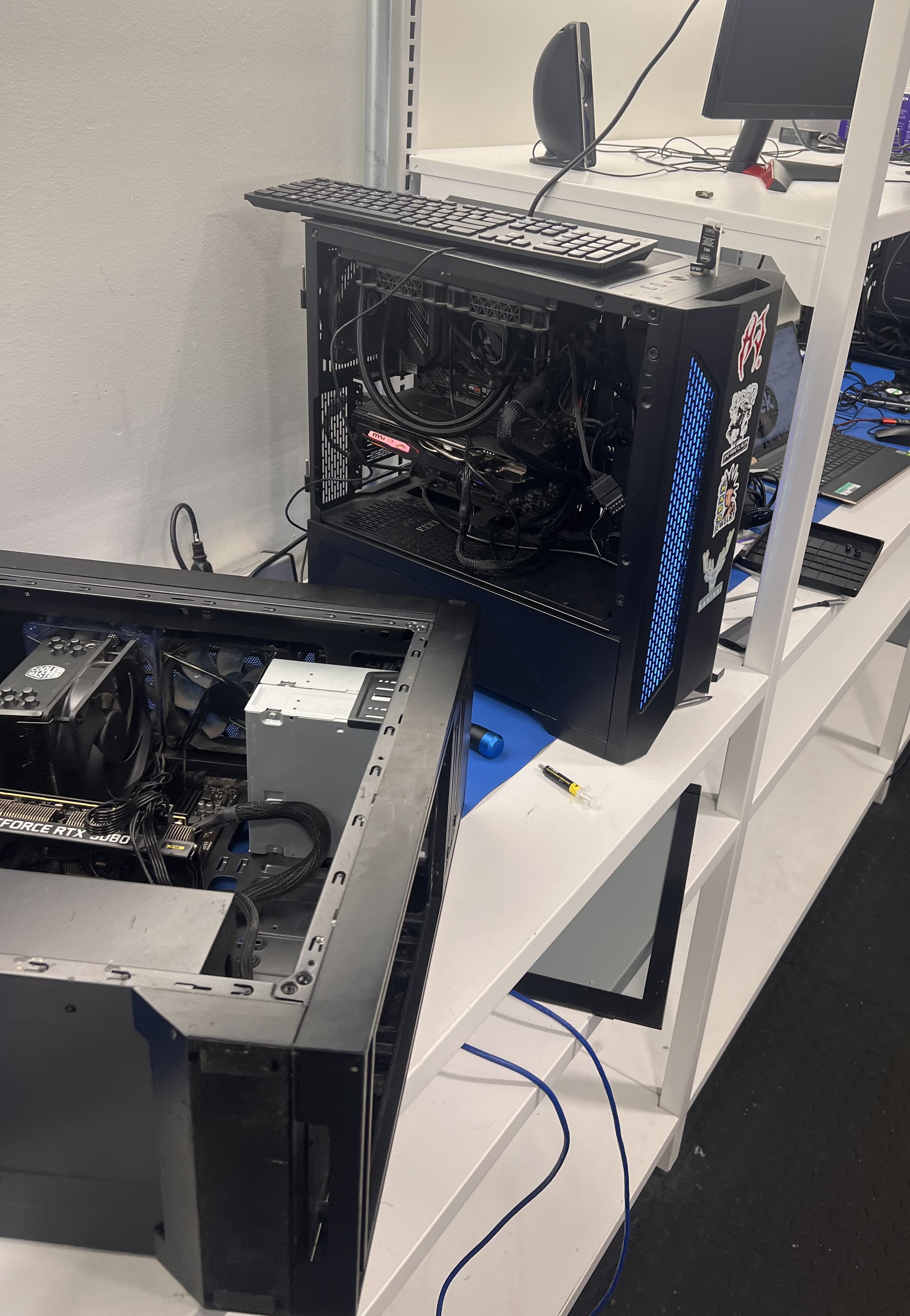 Completed laptop repair project showing professional motherboard repair and component replacement